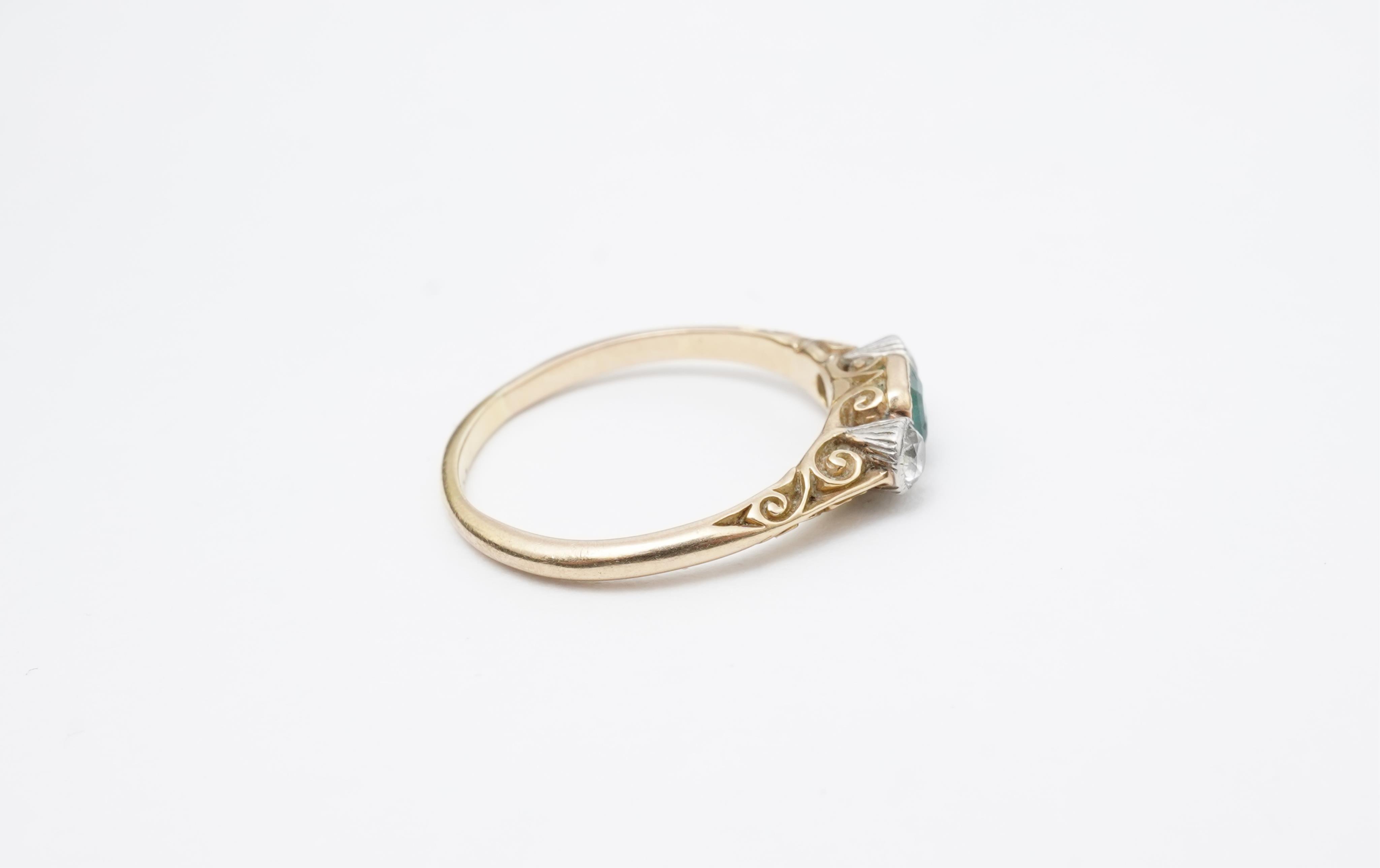 An emerald and diamond ring, early 20th century